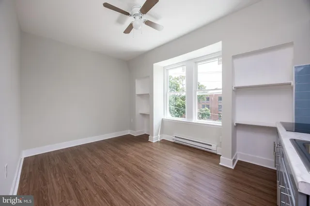 a kitchen with a white cabinets and white appliances
