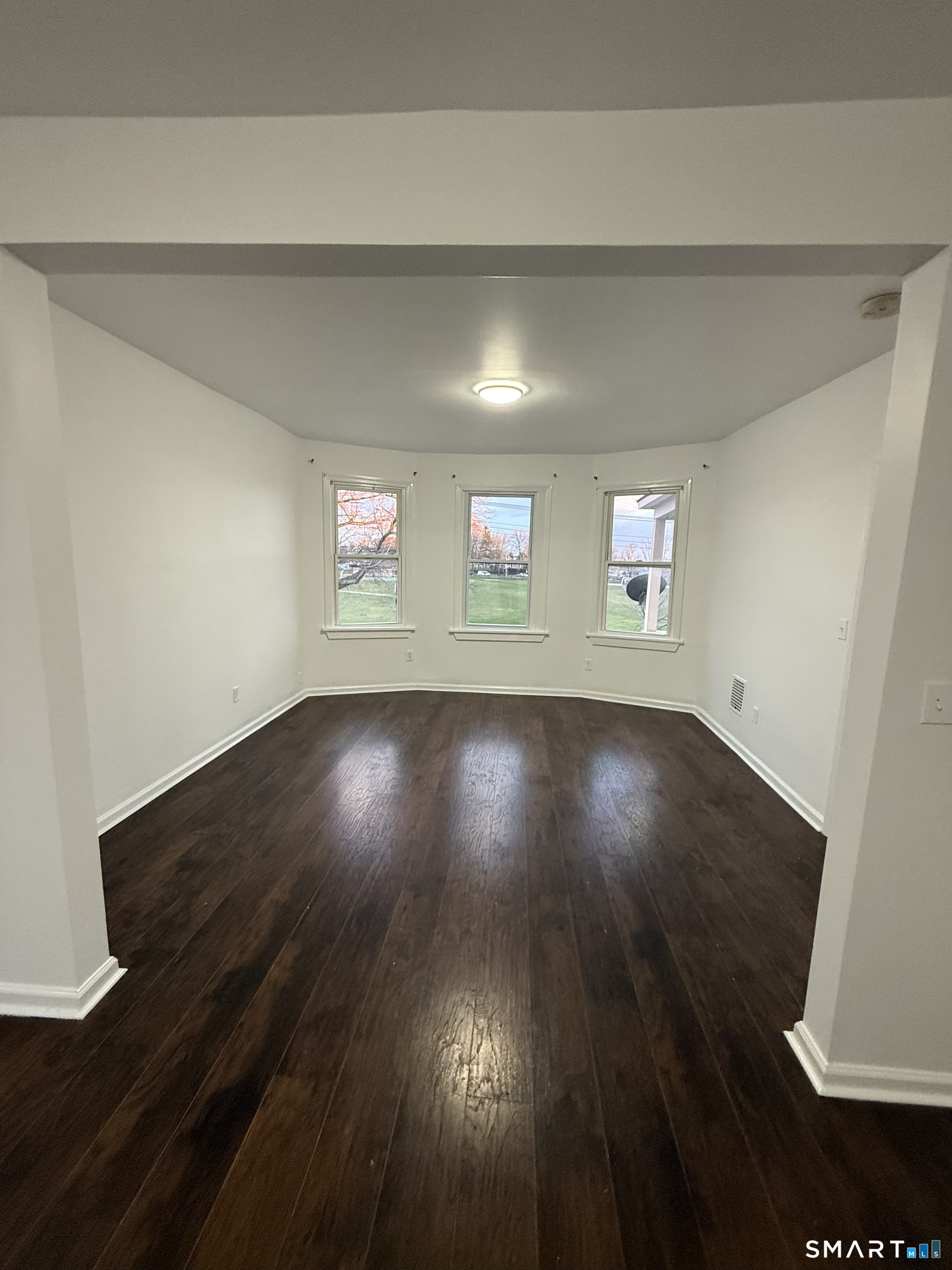 127 Eagle Street Bridgeport, CT 06607 - Photo 5 of 14 This move-in ready apartment features fresh paint and luxury wood-look flooring throughout.