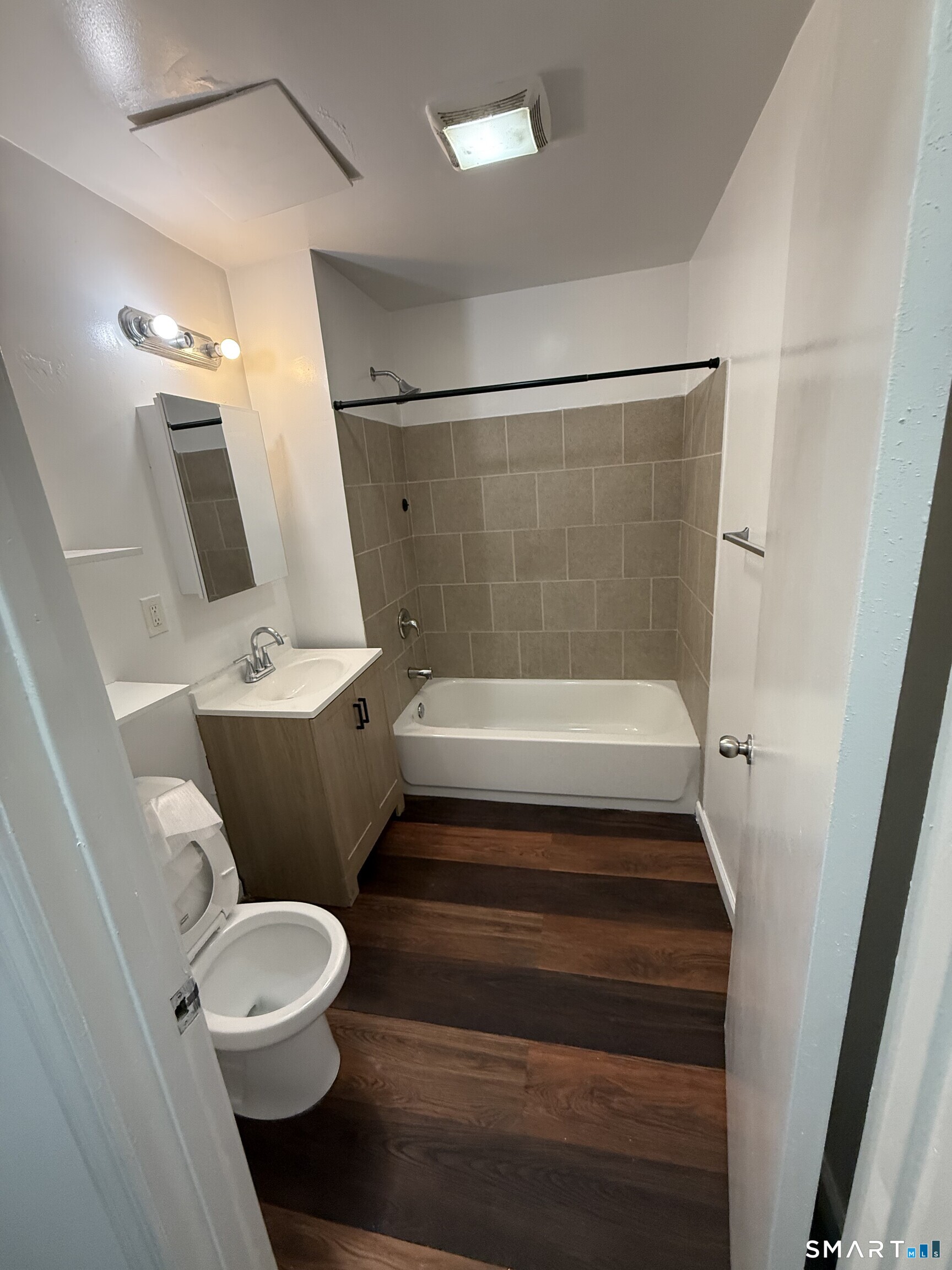 127 Eagle Street Bridgeport, CT 06607 - Photo 10 of 14 The renovated full bathroom offers a tub/shower combination.