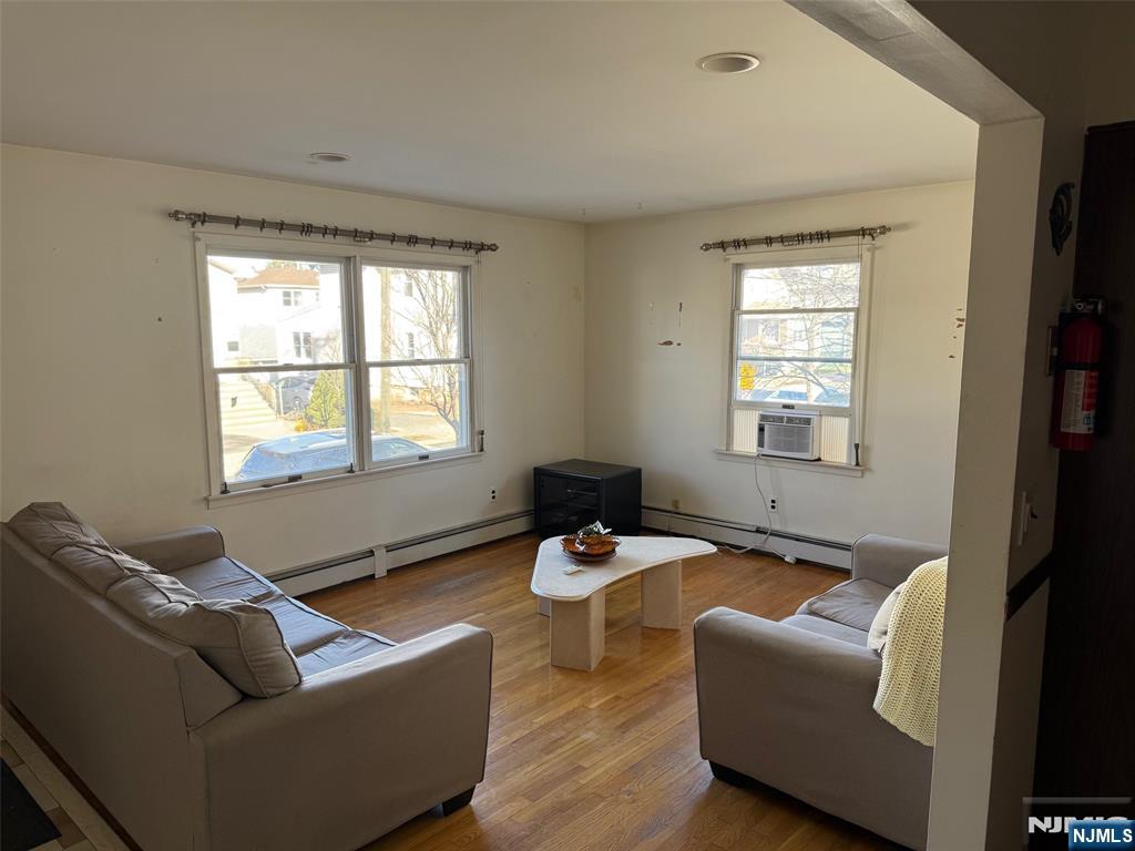 581 Broad Street, Unit 2 Carlstadt, NJ 07072 - Photo 2 of 15 a living room with furniture and a window
