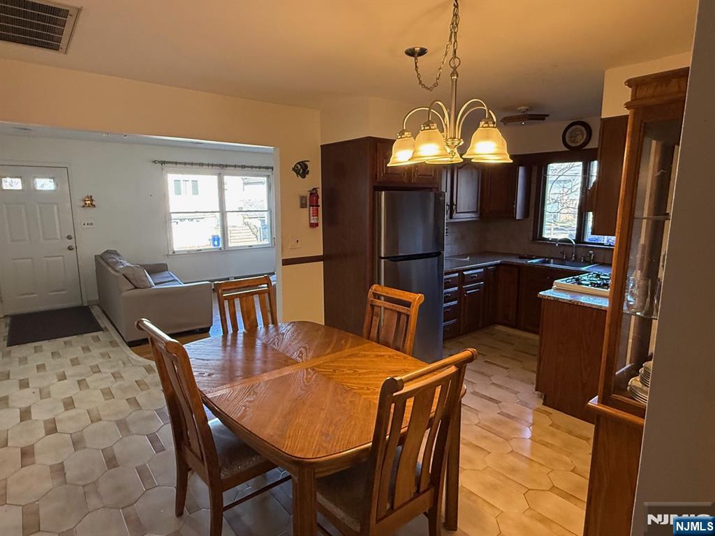 581 Broad Street, Unit 2 Carlstadt, NJ 07072 - Photo 5 of 15 a view of a dining room with furniture