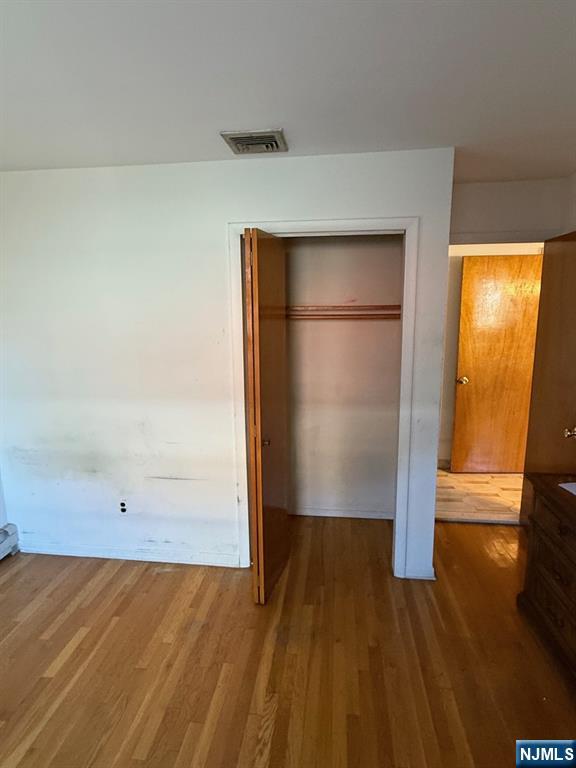581 Broad Street, Unit 2 Carlstadt, NJ 07072 - Photo 7 of 15 a view of empty room with wooden floor