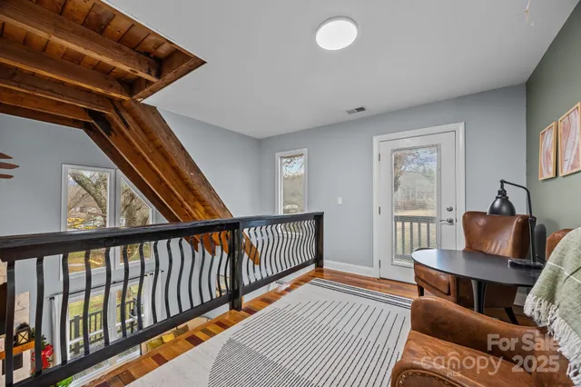 a view of an empty room with gym equipment