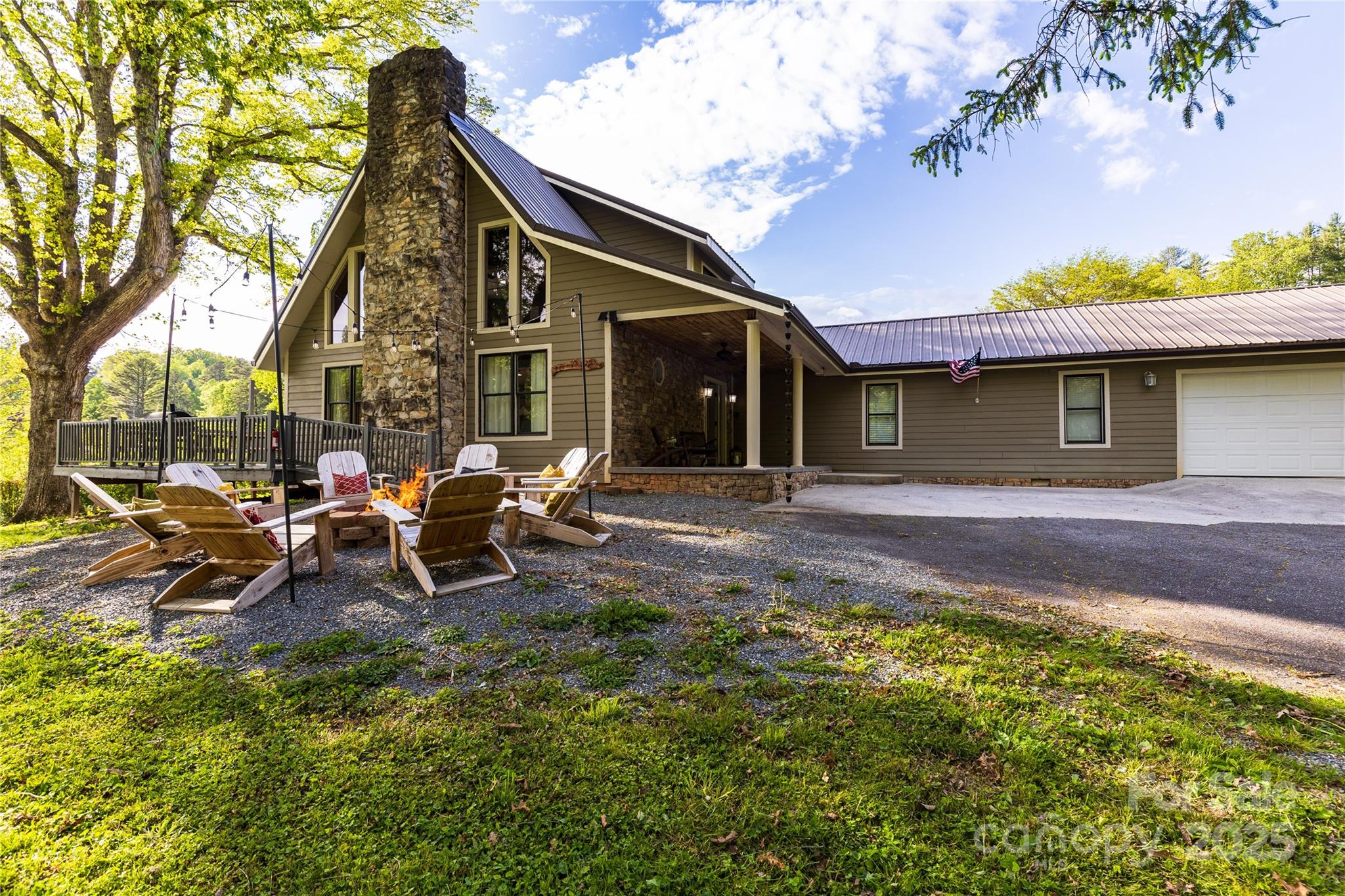 540 Toot Hollow Road Bryson City, NC 28713 - Photo 2 of 47 a view of a house with sitting area and garden