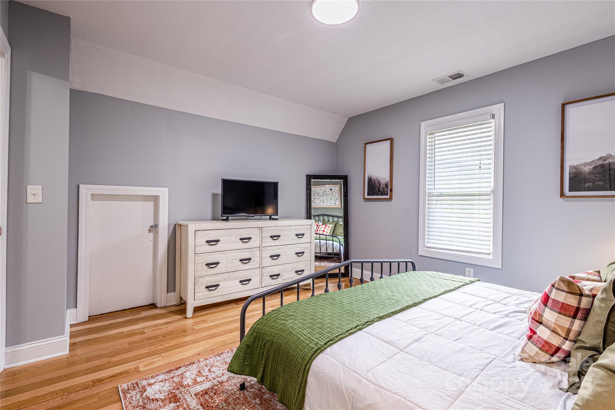 540 Toot Hollow Road Bryson City, NC 28713 - Photo 28 of 47 a bedroom with a bed and flat screen tv
