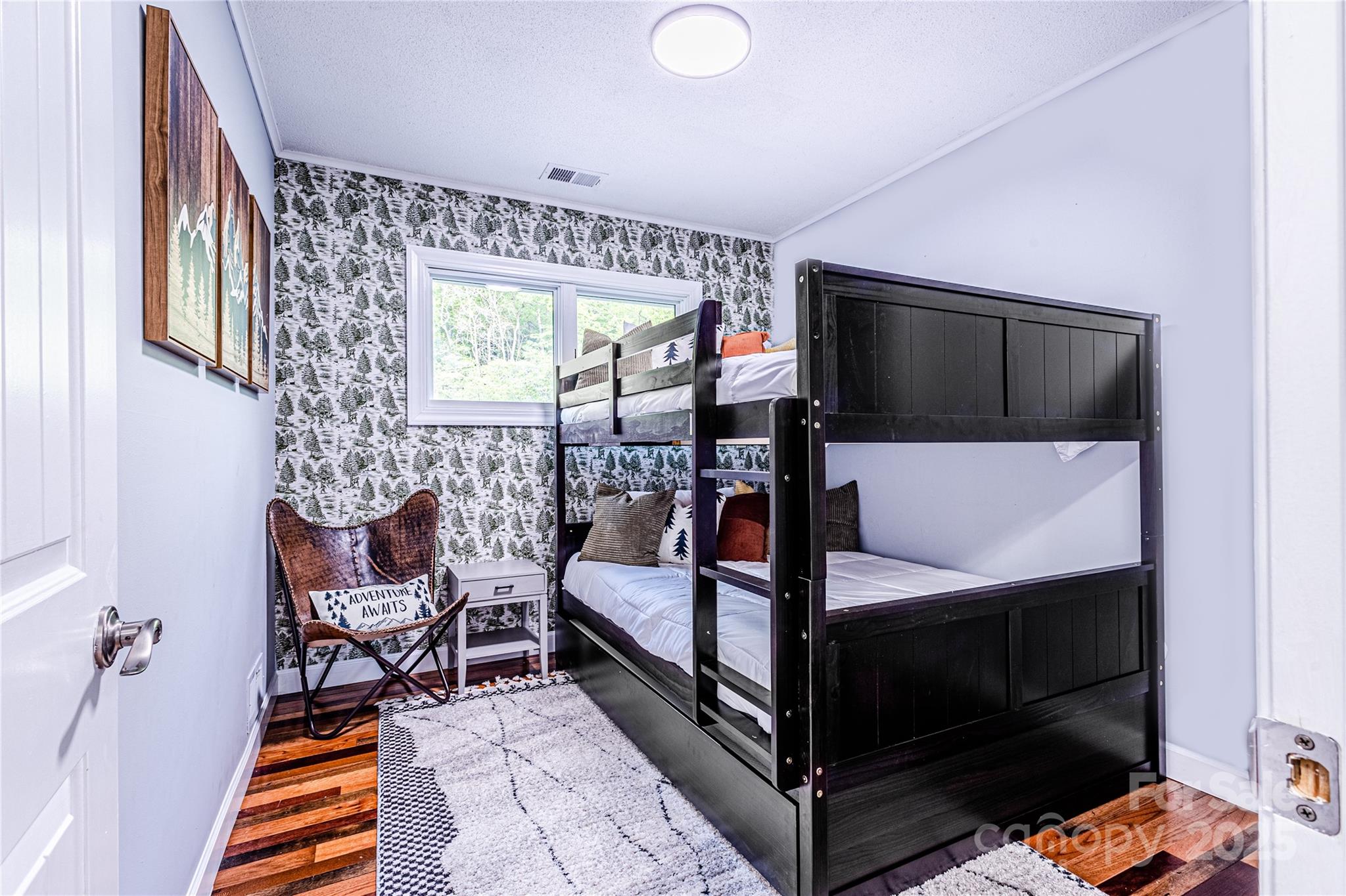 540 Toot Hollow Road Bryson City, NC 28713 - Photo 29 of 47 a bedroom with furniture and a flat screen tv
