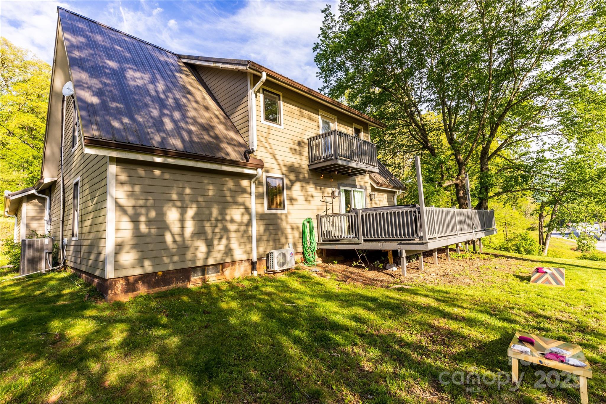 540 Toot Hollow Road Bryson City, NC 28713 - Photo 6 of 47 a view of a house with a big yard and sitting area