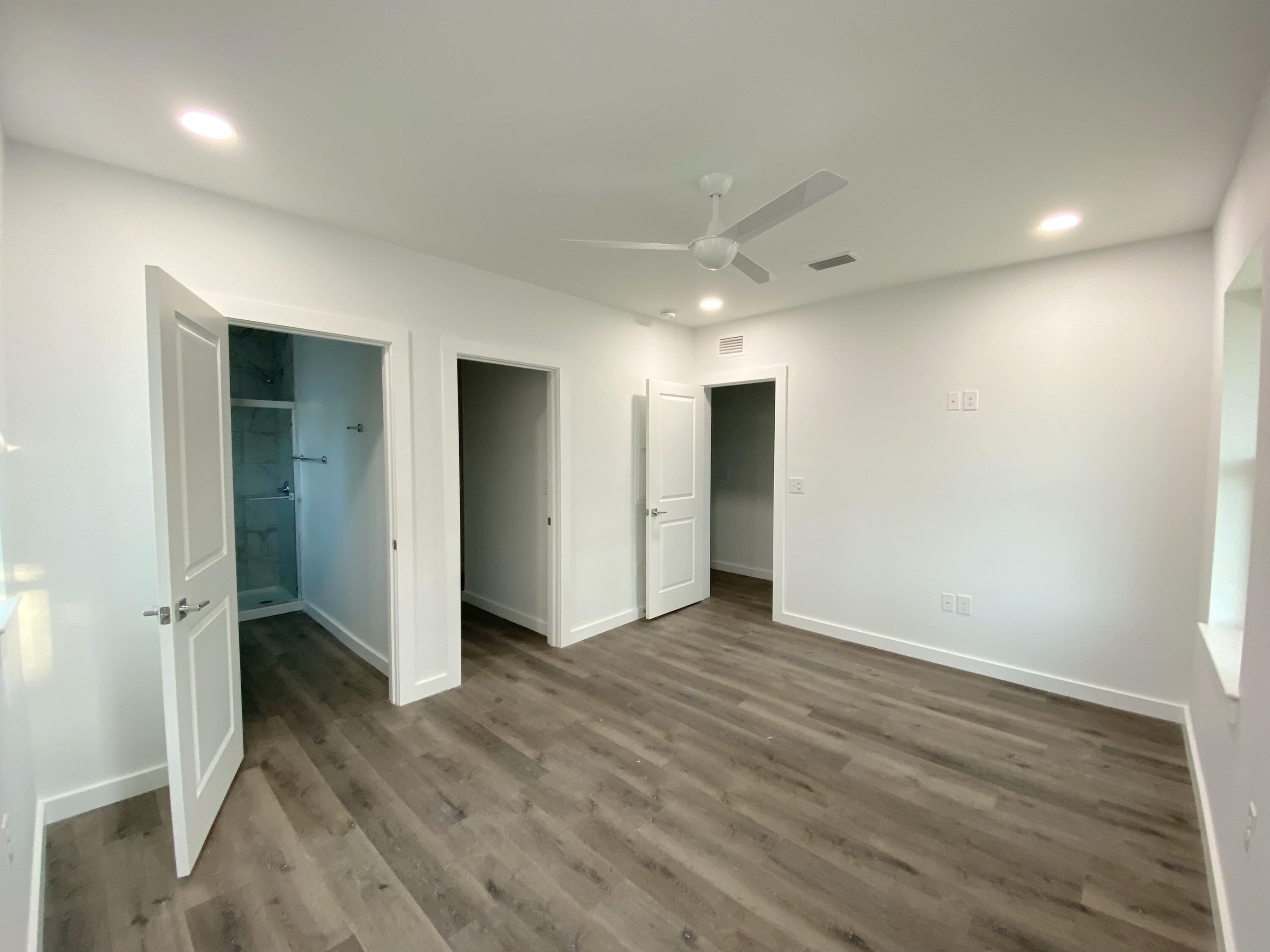 211 West Renoir Road DeFuniak Springs, FL 32433 - Photo 14 of 19 wooden floor in an empty room with wooden floor