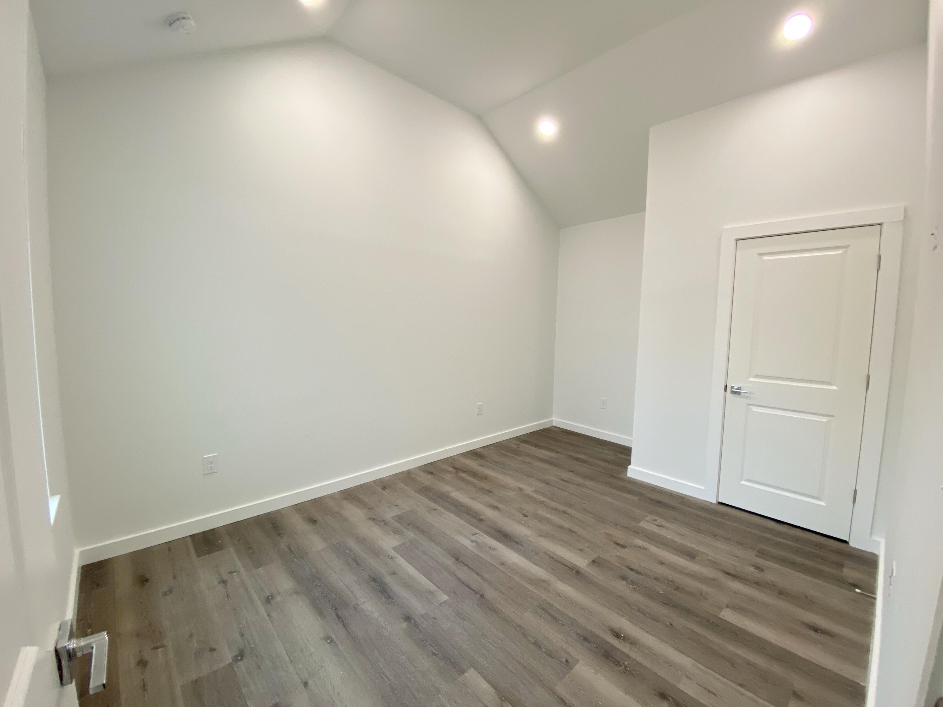 211 West Renoir Road DeFuniak Springs, FL 32433 - Photo 19 of 19 a view of an empty room with wooden floor
