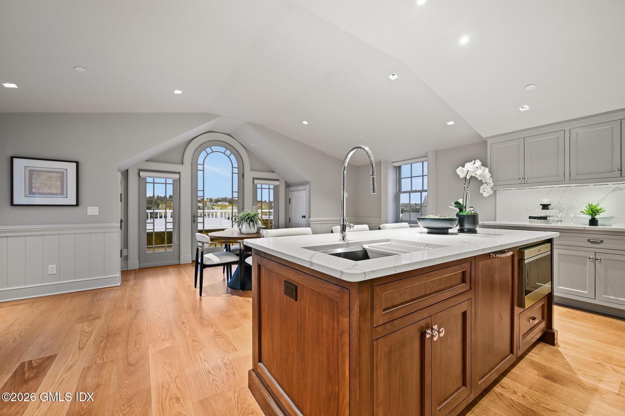 702 Steamboat Road, Unit 6 Greenwich, CT 06830 - Photo 16 of 45 a kitchen with a sink and cabinets