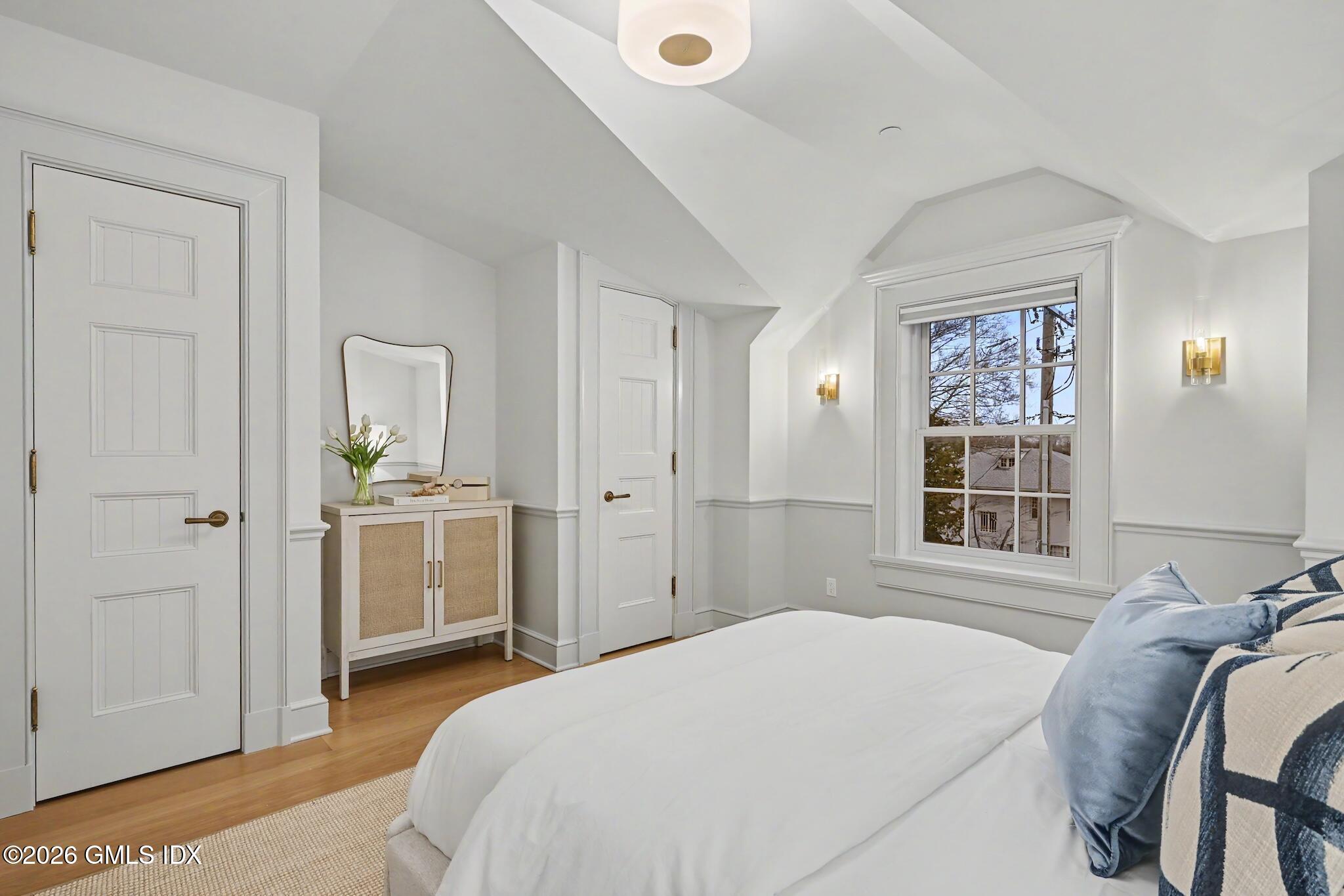 702 Steamboat Road, Unit 6 Greenwich, CT 06830 - Photo 25 of 45 a bedroom with a bed and a window