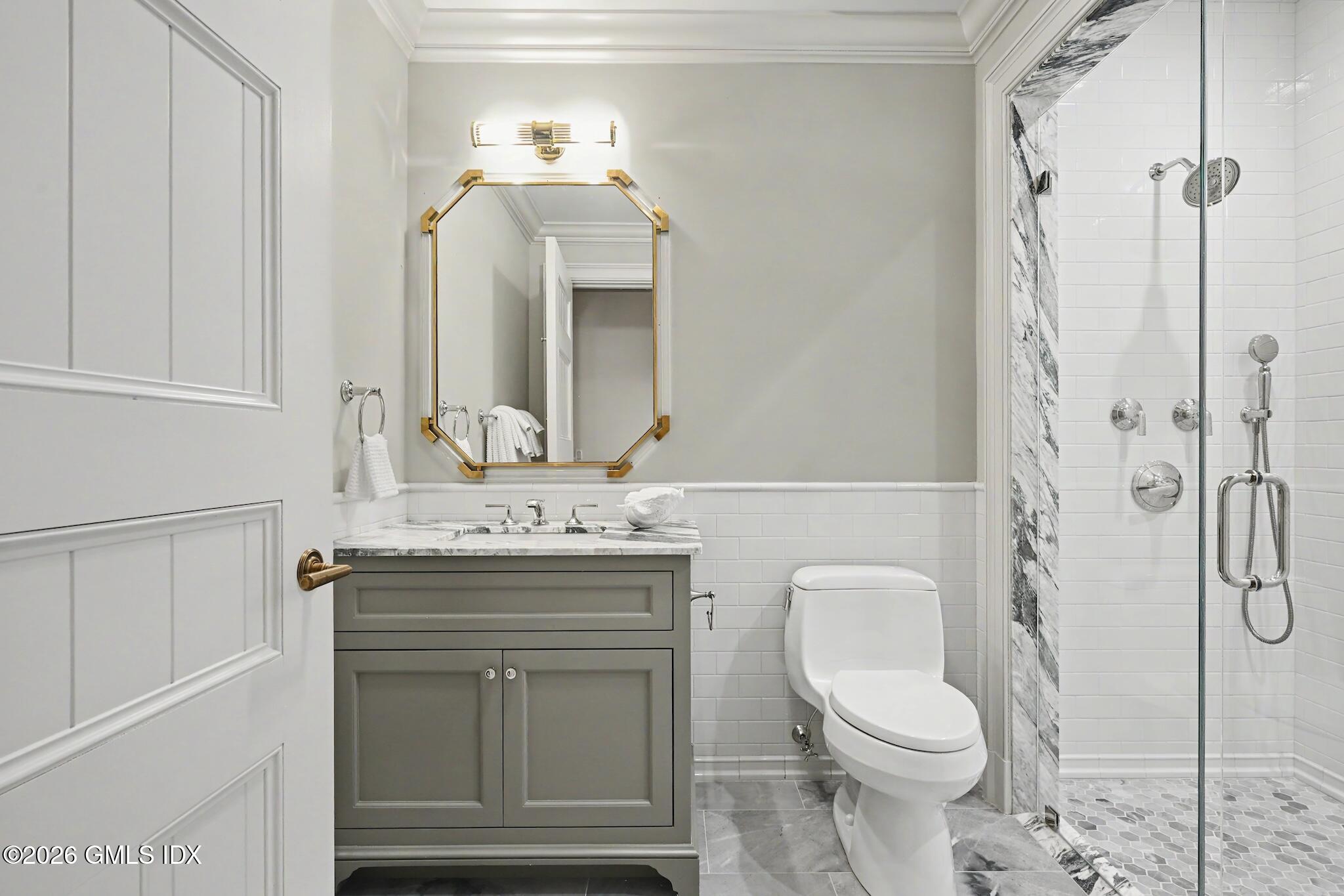 702 Steamboat Road, Unit 6 Greenwich, CT 06830 - Photo 27 of 45 a bathroom with a granite countertop toilet sink and mirror