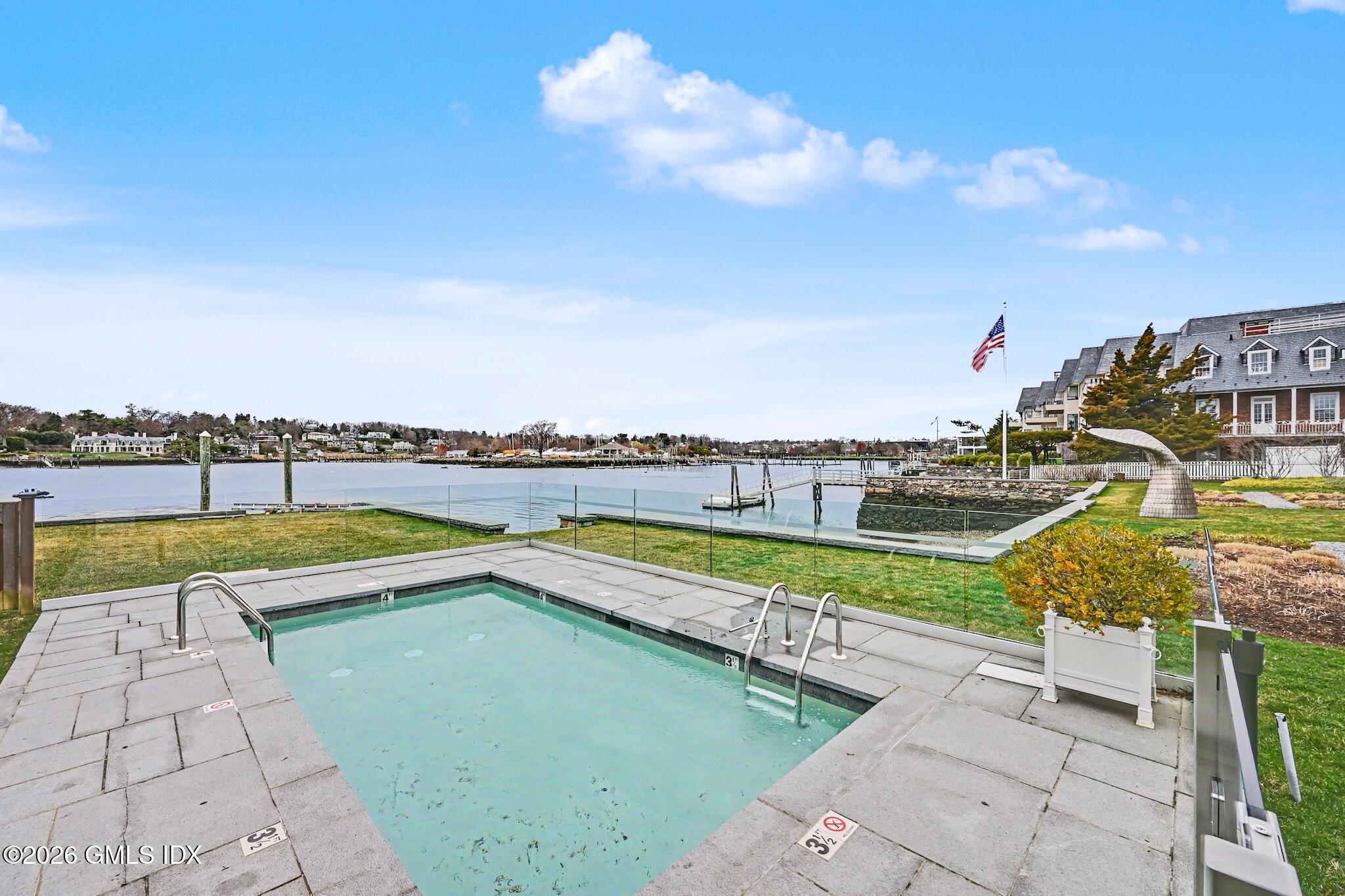 702 Steamboat Road, Unit 6 Greenwich, CT 06830 - Photo 34 of 45 a view of a swimming pool with a terrace