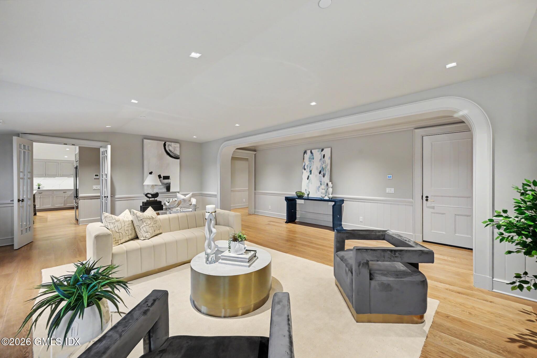 702 Steamboat Road, Unit 6 Greenwich, CT 06830 - Photo 5 of 45 a living room with furniture and a potted plant