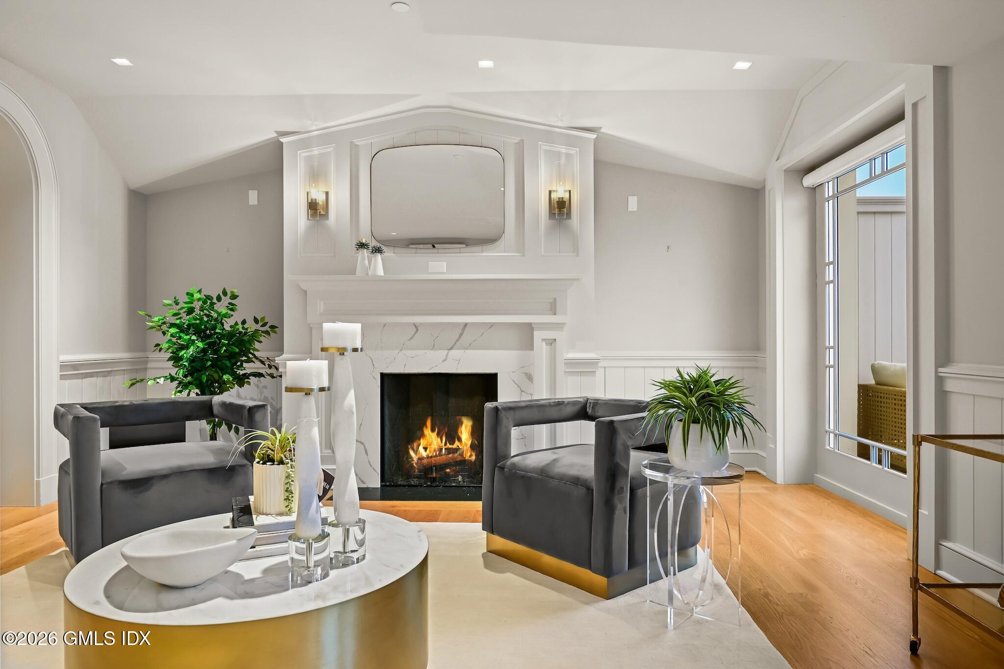 702 Steamboat Road, Unit 6 Greenwich, CT 06830 - Photo 6 of 45 a living room with furniture and a fireplace
