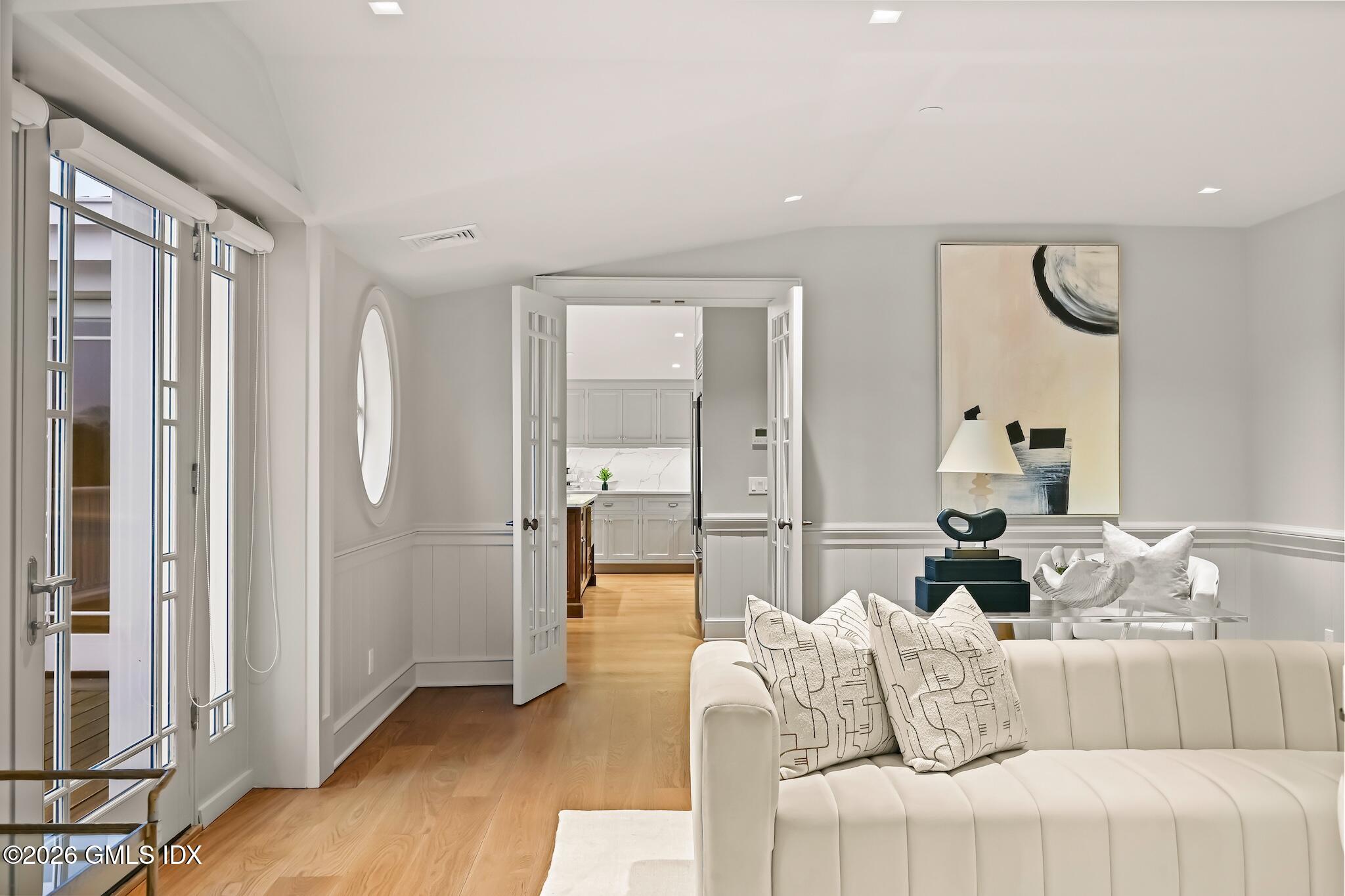 702 Steamboat Road, Unit 6 Greenwich, CT 06830 - Photo 7 of 45 a living room with furniture and a large window