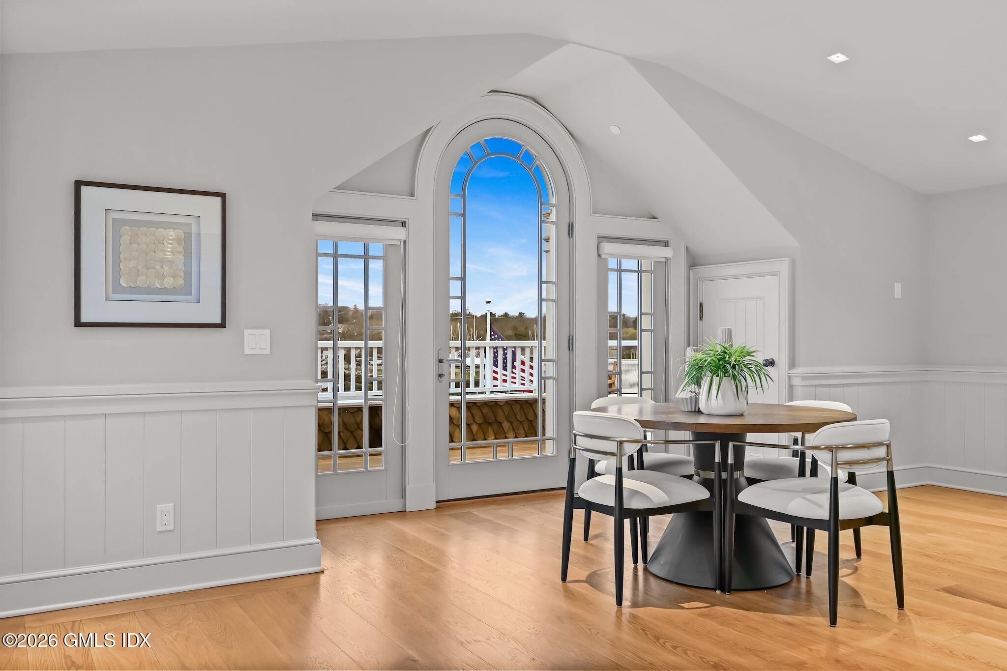 702 Steamboat Road, Unit 6 Greenwich, CT 06830 - Photo 10 of 45 a view of a dining room with furniture window and wooden floor