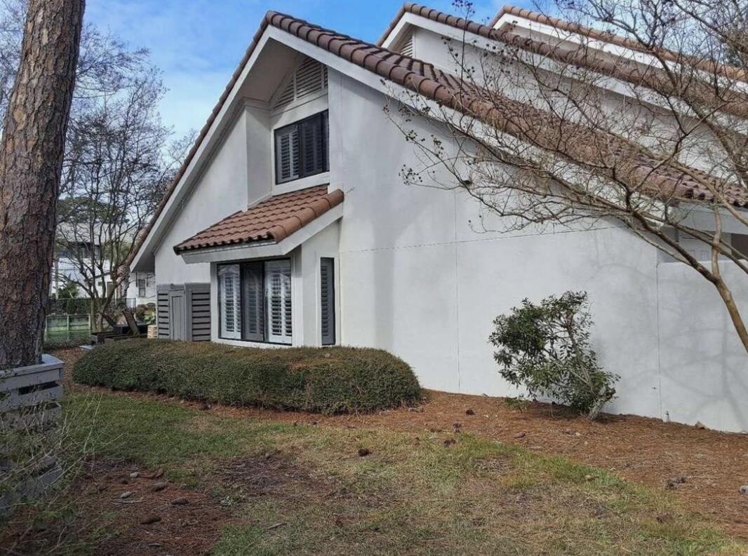 5054 Beachwalk Way Miramar Beach, FL 32550 - Photo 2 of 28 a view of a house with a yard