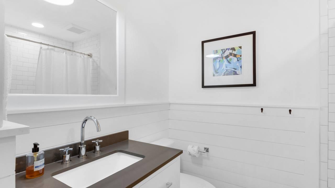 5054 Beachwalk Way Miramar Beach, FL 32550 - Photo 21 of 28 a bathroom with a sink and a mirror