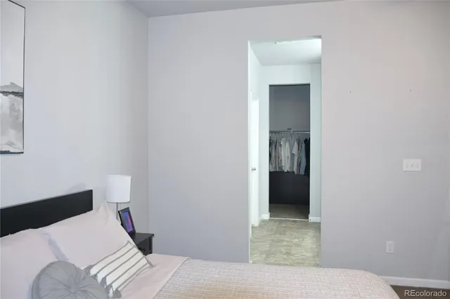 a bedroom with a bed and closet
