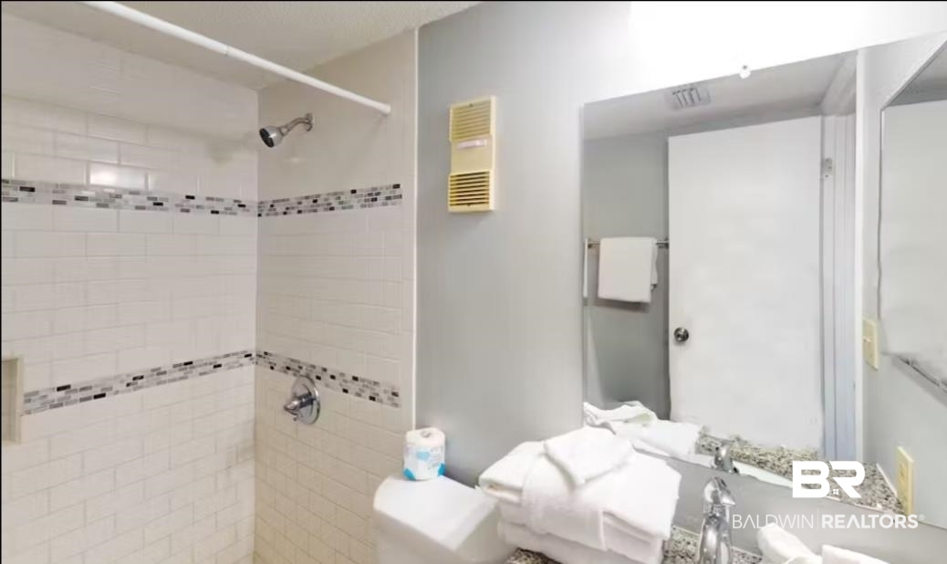 375 Plantation Road, Unit 5814 Gulf Shores, AL 36542 - Photo 12 of 31 Bathroom featuring a tile shower and toilet