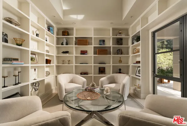 a kitchen with stainless steel appliances granite countertop a stove oven and a refrigerator with white cabinets