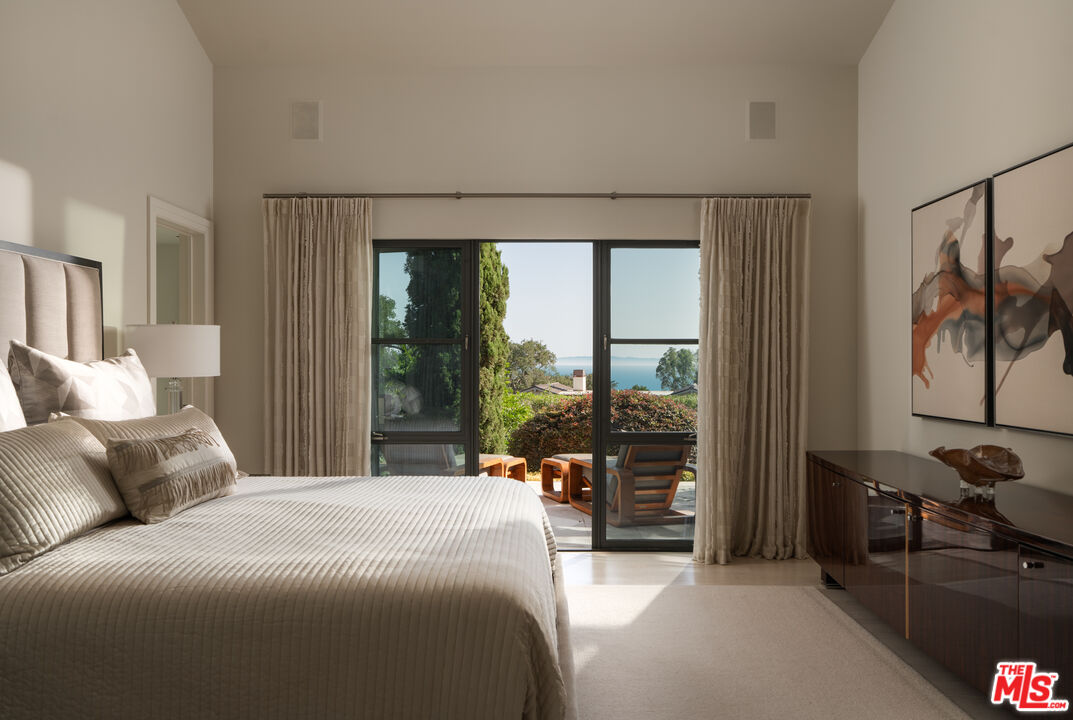 796 Hot Springs Road Montecito, CA 93108 - Photo 19 of 47 a bedroom with a bed and a large window