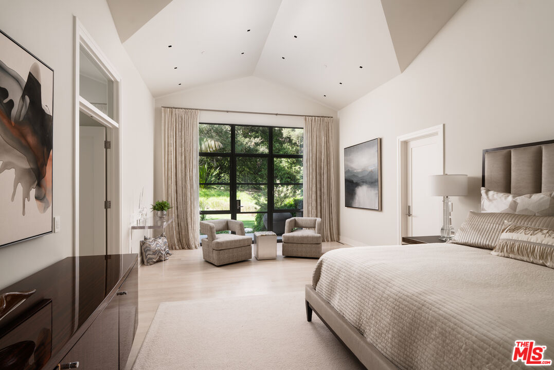 796 Hot Springs Road Montecito, CA 93108 - Photo 20 of 47 a spacious bedroom with a large bed and a large window