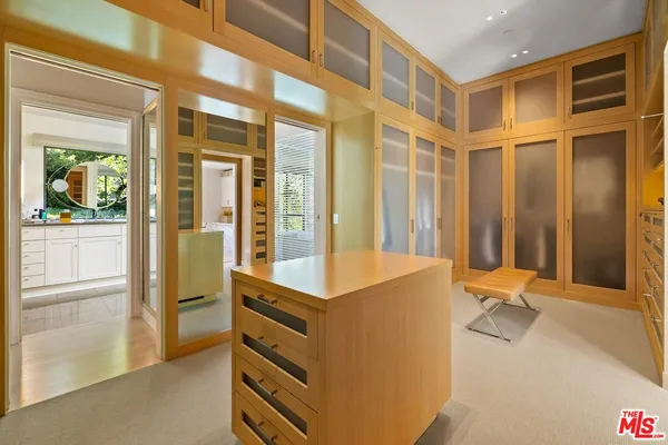 a bathroom with a granite countertop sink mirror and a bathtub