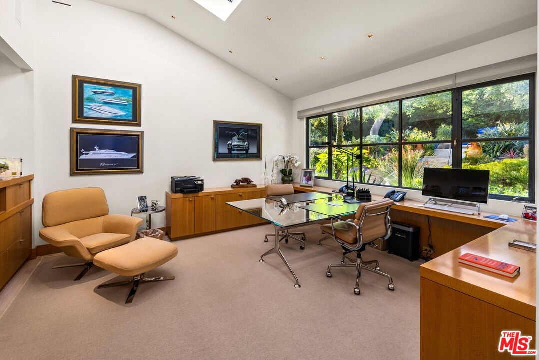 796 Hot Springs Road Montecito, CA 93108 - Photo 23 of 47 a living room with furniture and a flat screen tv