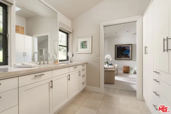 a spacious bathroom with a tub and shower