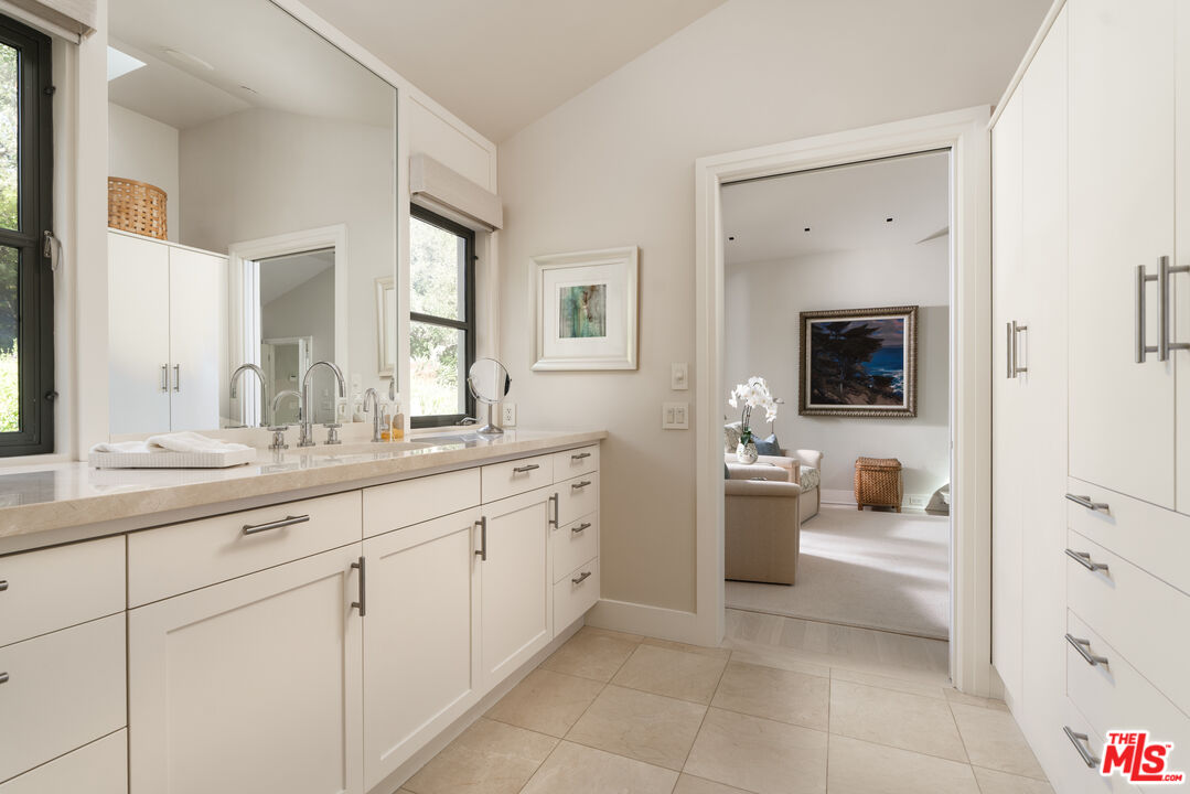 796 Hot Springs Road Montecito, CA 93108 - Photo 26 of 47 a bathroom with a sink a washer and dryer