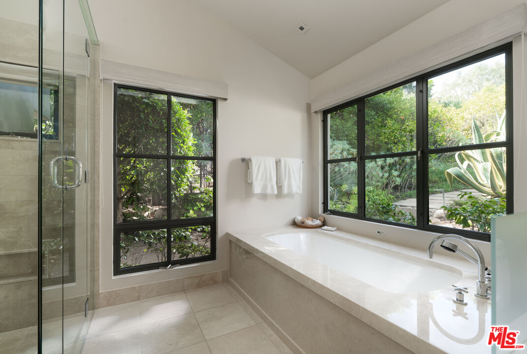 796 Hot Springs Road Montecito, CA 93108 - Photo 27 of 47 a spacious bathroom with a tub and shower