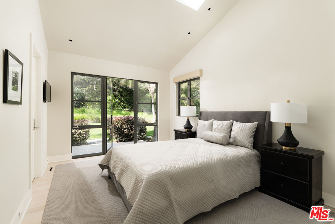 796 Hot Springs Road Montecito, CA 93108 - Photo 28 of 47 a bedroom with a bed and a large window