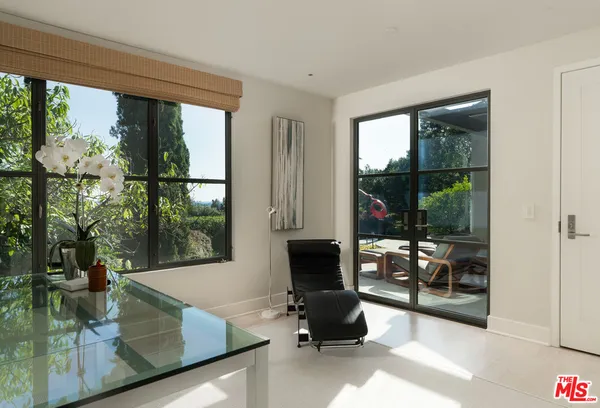 a view of a street with a tree