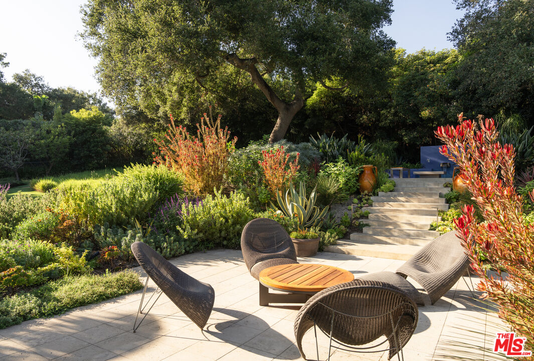 796 Hot Springs Road Montecito, CA 93108 - Photo 34 of 47 a backyard of a house with yard and outdoor seating
