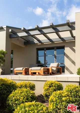 a view of a house with swimming pool garden and patio