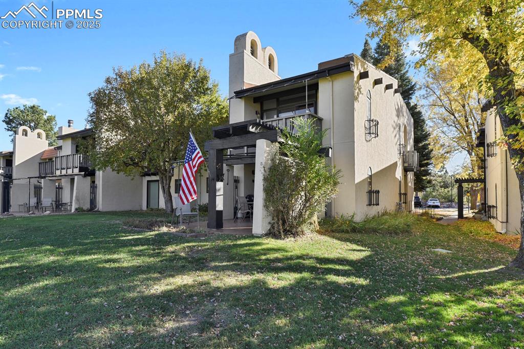 1006 Fontmore Road, Unit C Colorado Springs, CO 80904 - Photo 30 of 33 a front view of a house with garden