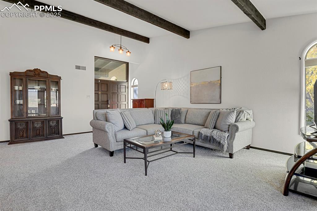 1006 Fontmore Road, Unit C Colorado Springs, CO 80904 - Photo 3 of 33 a living room with furniture and a flat screen tv