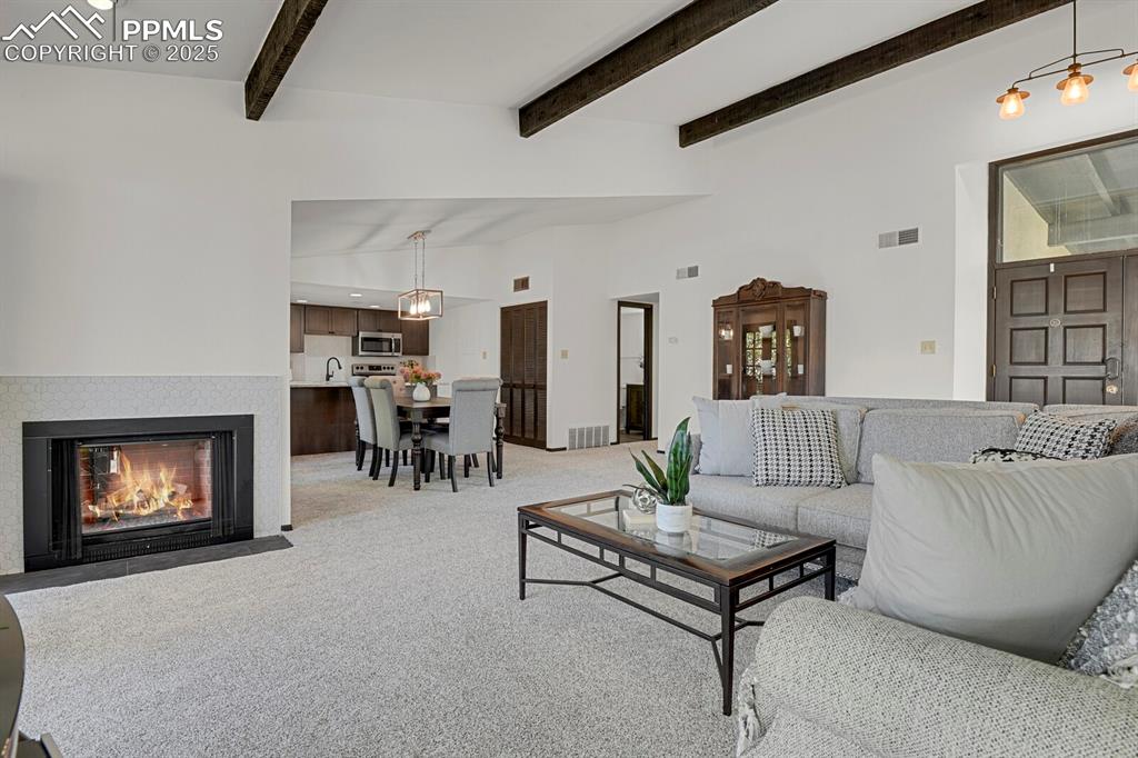 1006 Fontmore Road, Unit C Colorado Springs, CO 80904 - Photo 5 of 33 a living room with furniture and a fireplace