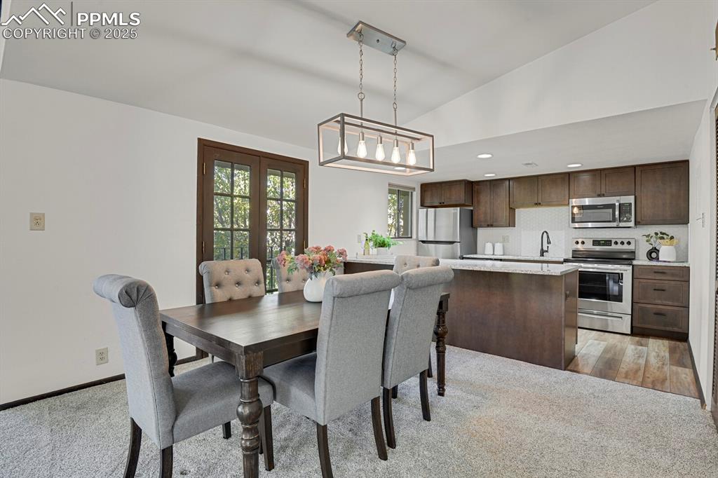 1006 Fontmore Road, Unit C Colorado Springs, CO 80904 - Photo 7 of 33 a view of a dining room with furniture window and wooden floor
