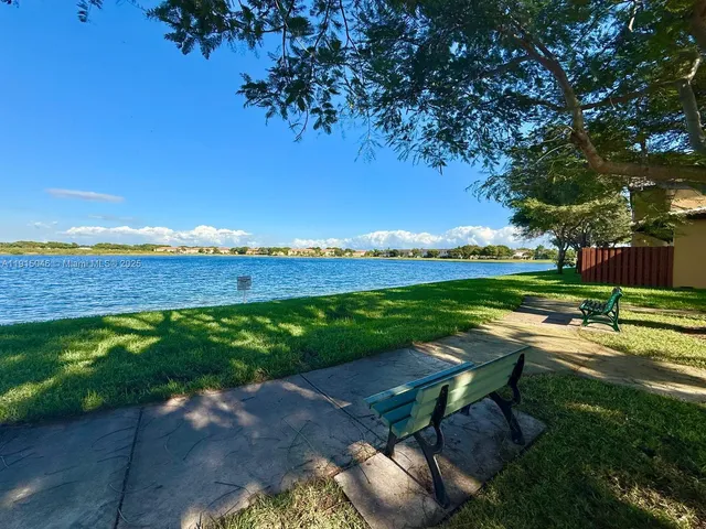 an aerial view of a house with a swimming pool
