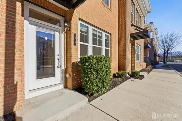 a couple of potted plants in front of building