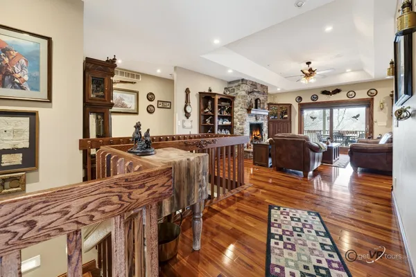 a view of a dining room with furniture chandelier and wooden floor