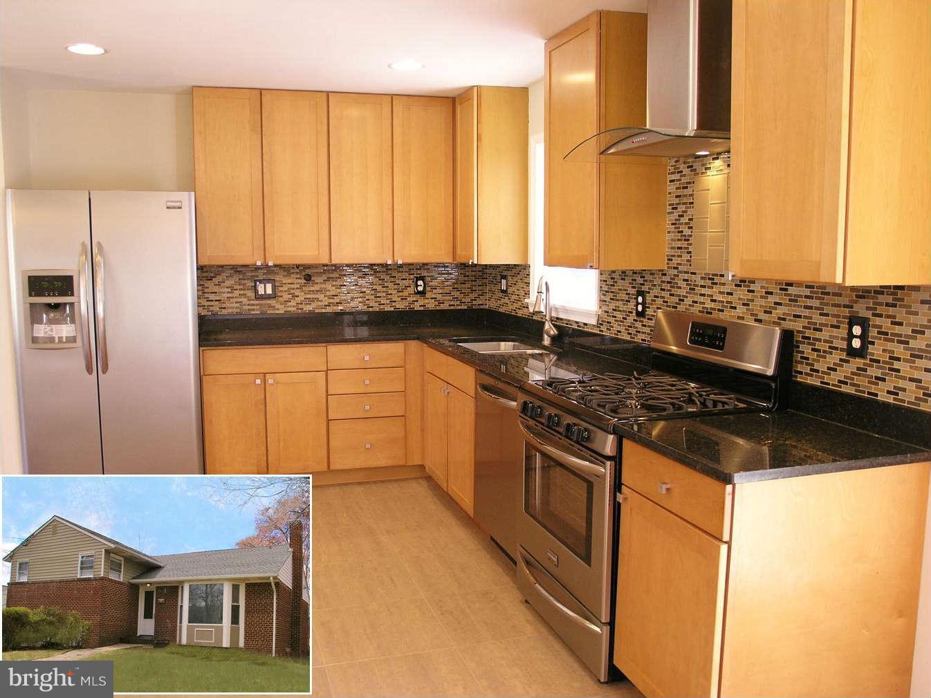 2011 Cascade Road Silver Spring, MD 20902 - Photo 1 of 24 a kitchen with stainless steel appliances granite countertop a stove a sink and a refrigerator