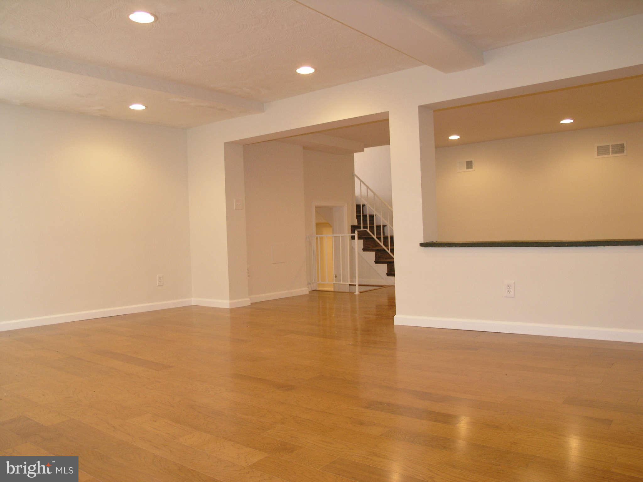 2011 Cascade Road Silver Spring, MD 20902 - Photo 12 of 24 a view of an empty room with wooden floor