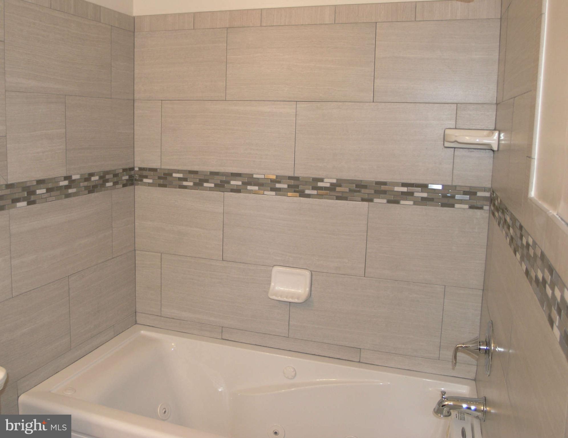 2011 Cascade Road Silver Spring, MD 20902 - Photo 17 of 24 a bathroom with a shower