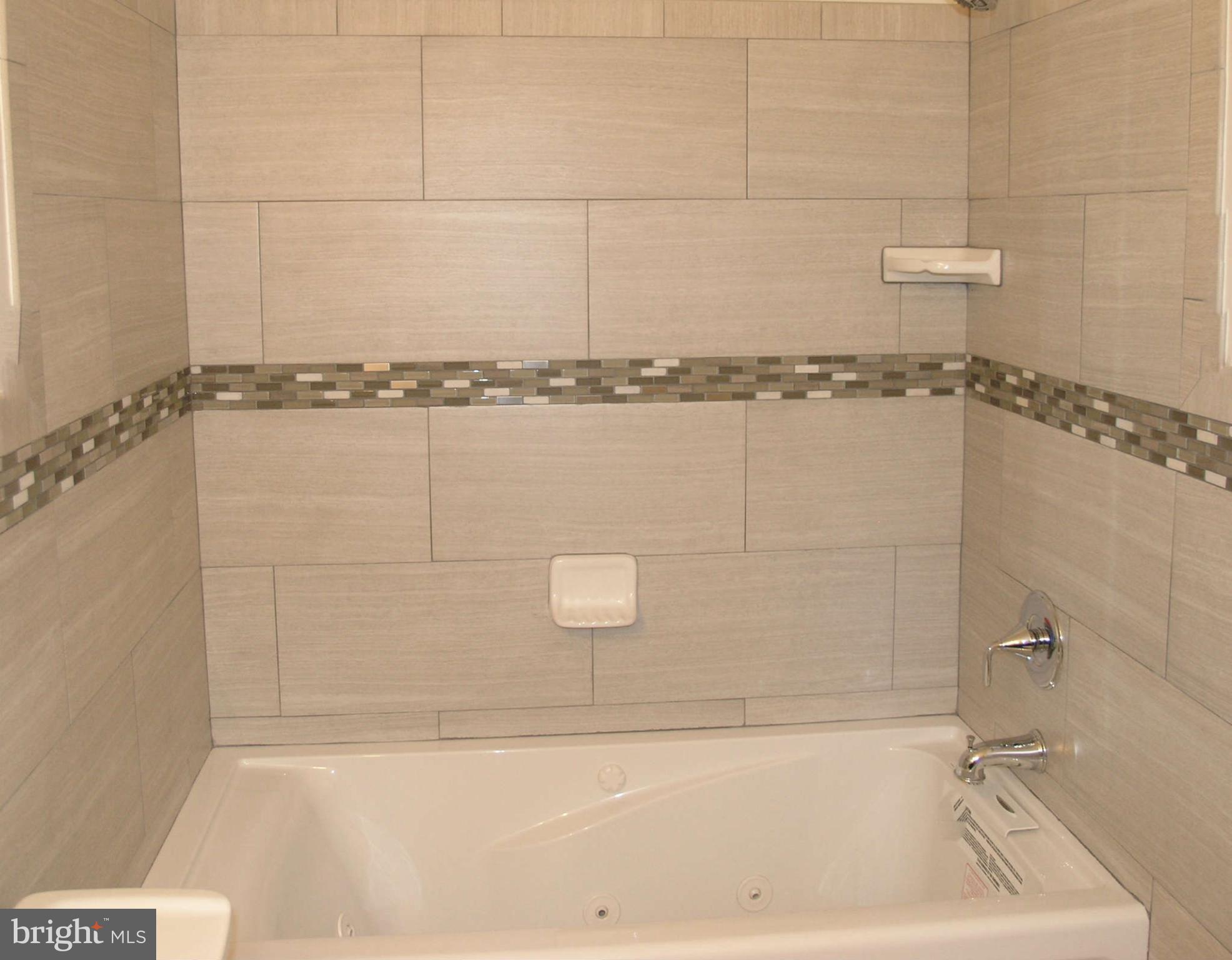 2011 Cascade Road Silver Spring, MD 20902 - Photo 18 of 24 a bathroom with a bathtub
