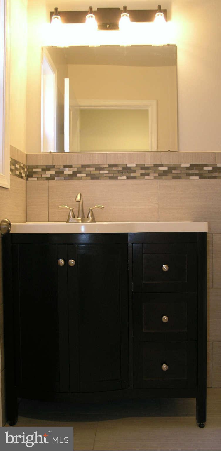 2011 Cascade Road Silver Spring, MD 20902 - Photo 20 of 24 a view of a double vanity and a sink