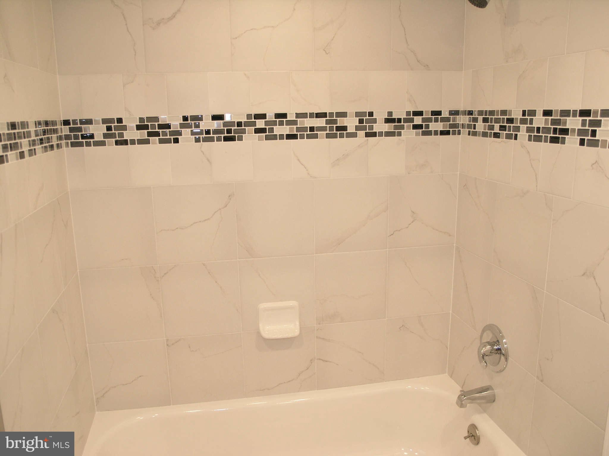 2011 Cascade Road Silver Spring, MD 20902 - Photo 24 of 24 a bathroom with a bathtub and shower